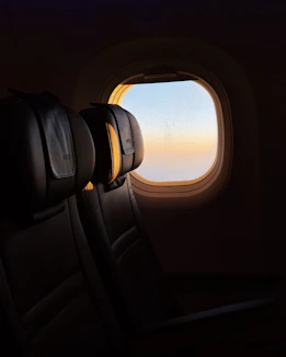 Sunrise seen from an airplane window.
