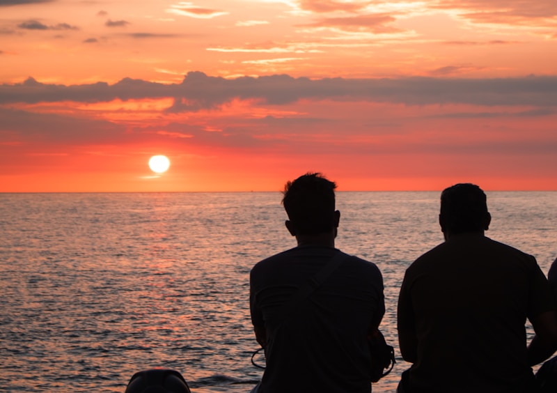 Two people admiring sunset