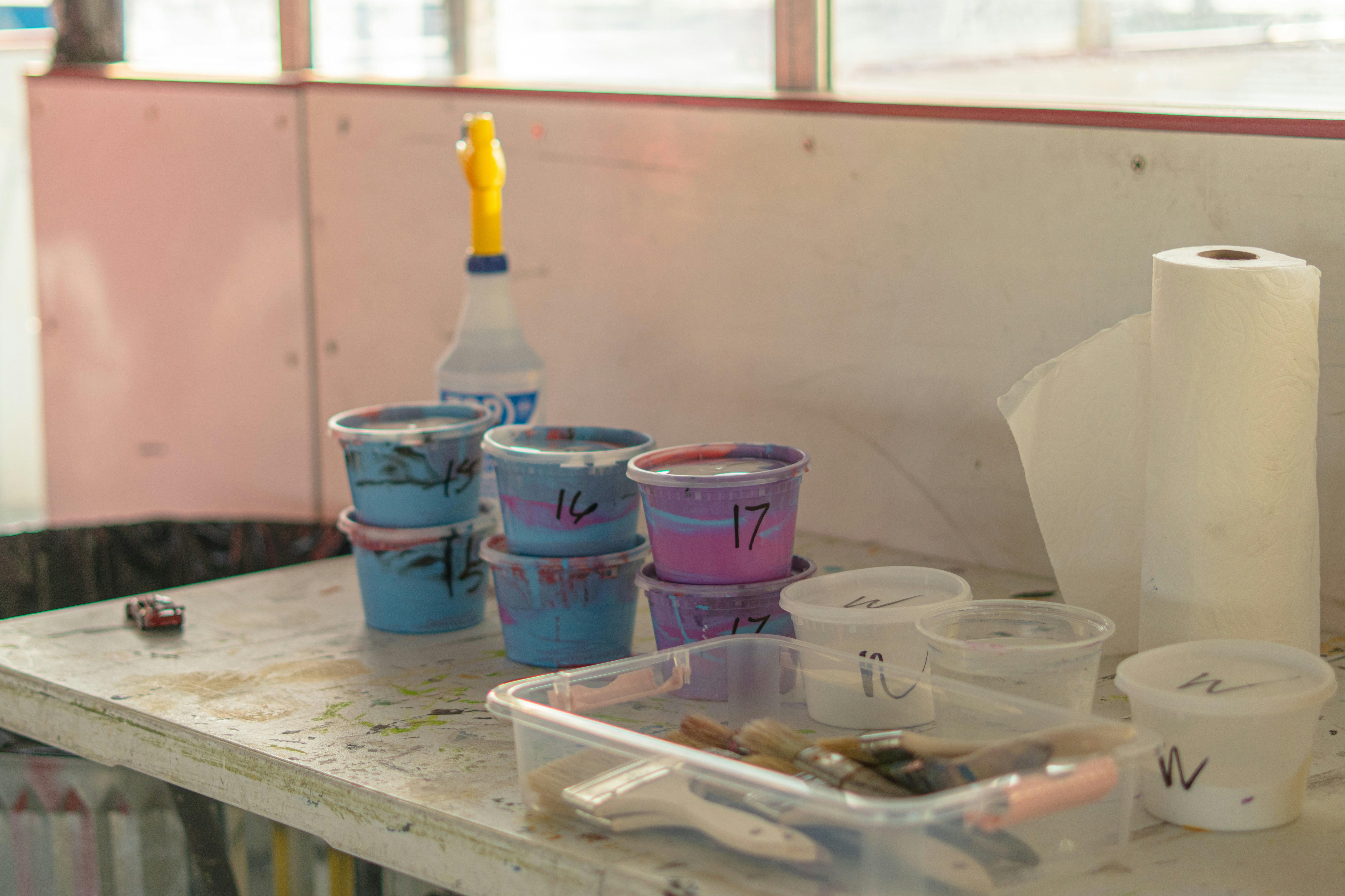 Paints and supplies on work table