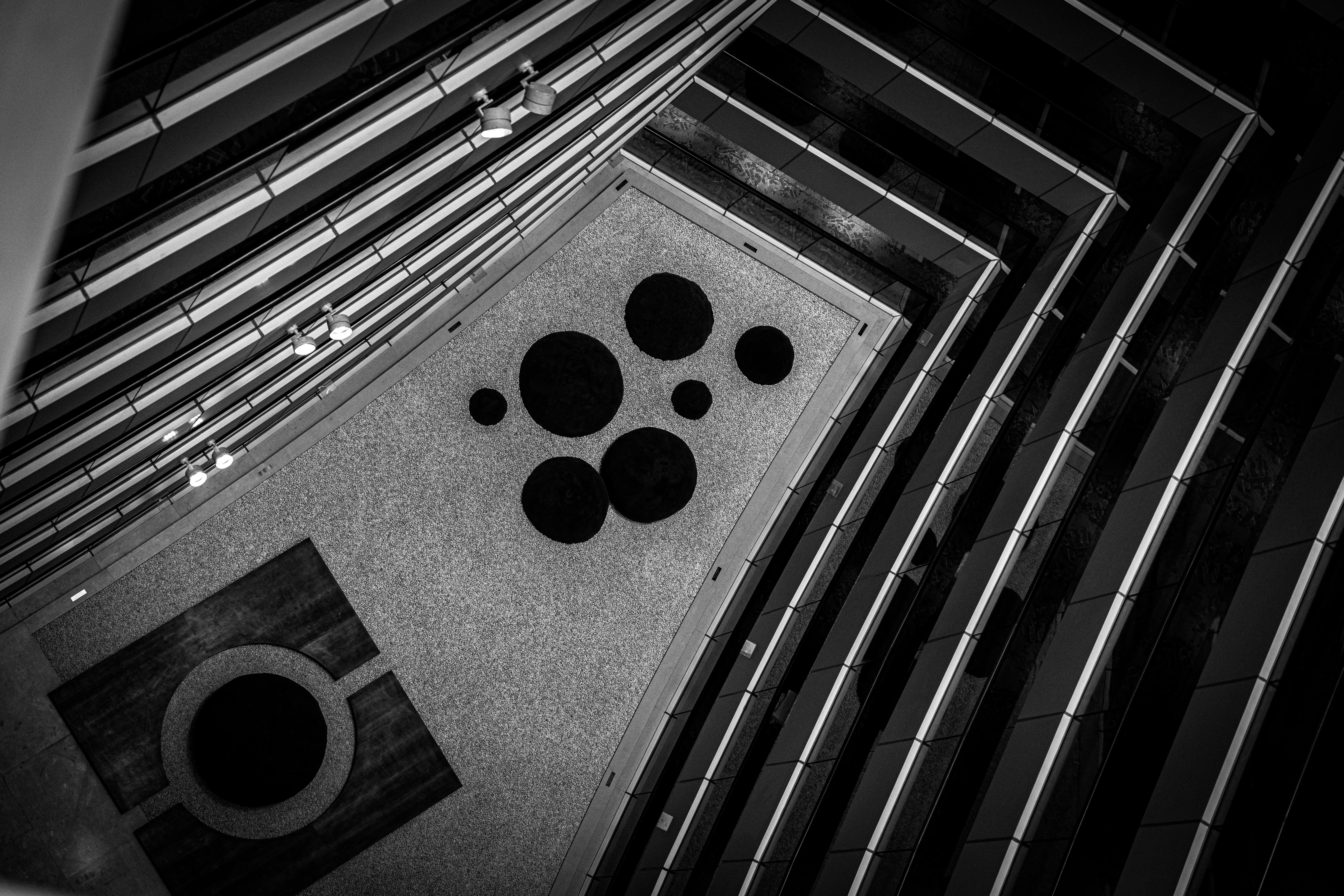 Inside of a tall building, looking down. photo – Free Building Image on ...