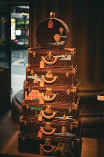 Stacked, decorative louis vuitton luggage displays its artistry.