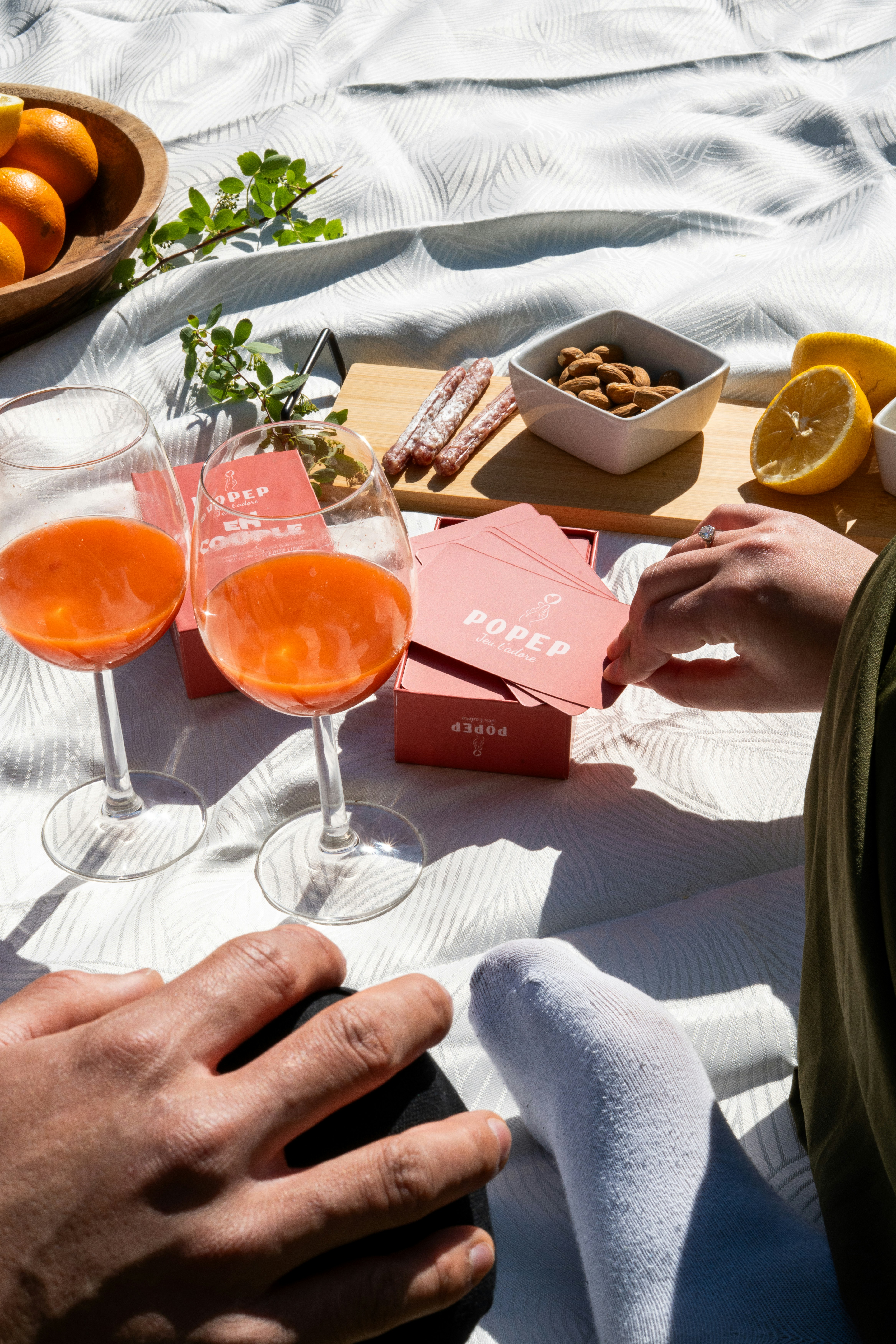 Picnic setup with games, food, and drinks.