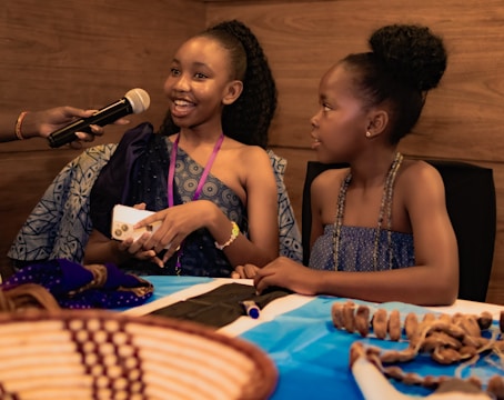 Two young girls are being interviewed.