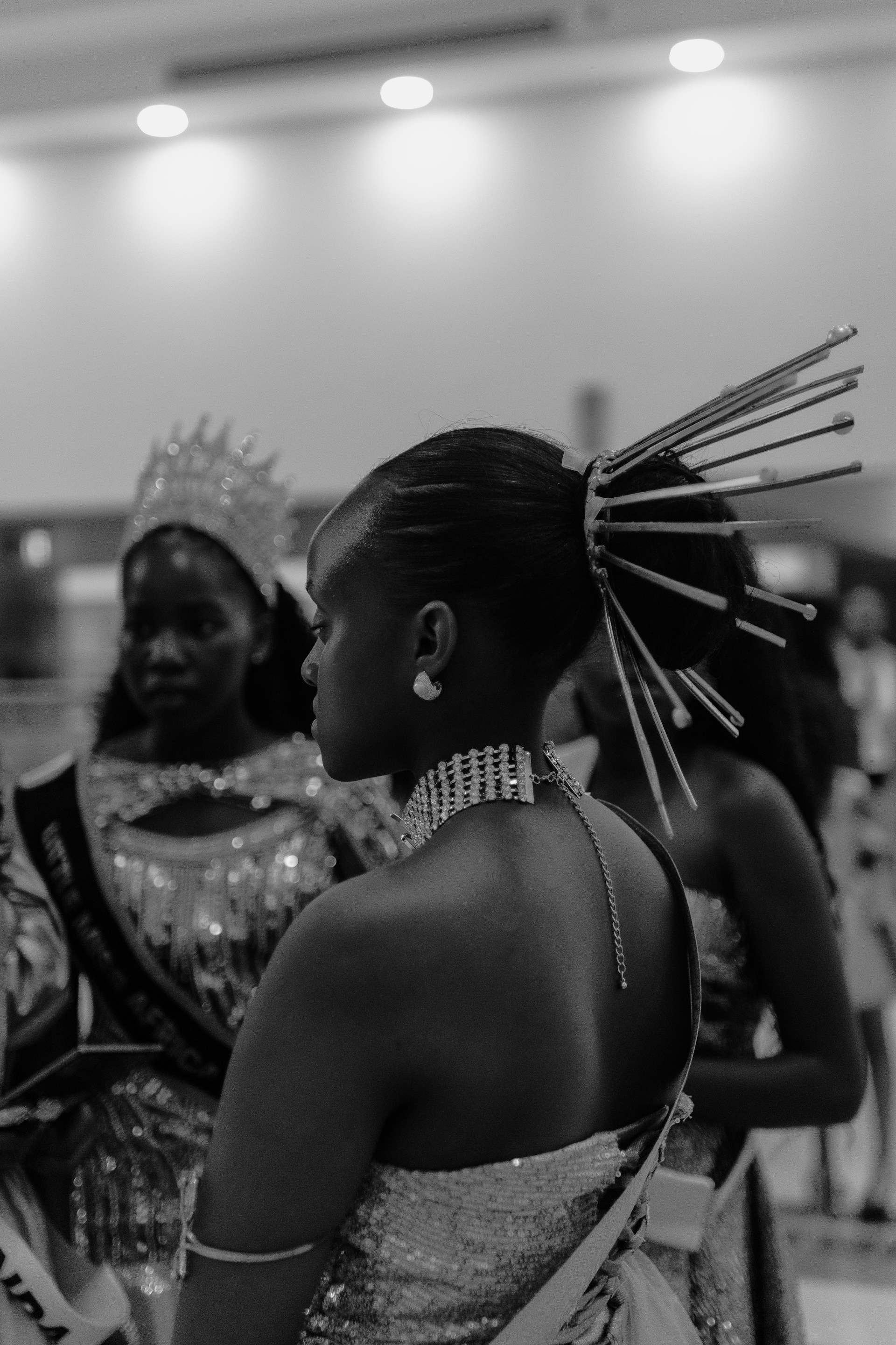 A woman with elaborate hair and attire.