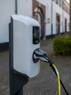 An electric vehicle charging station is plugged in.