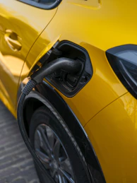An electric car is charging at a station.