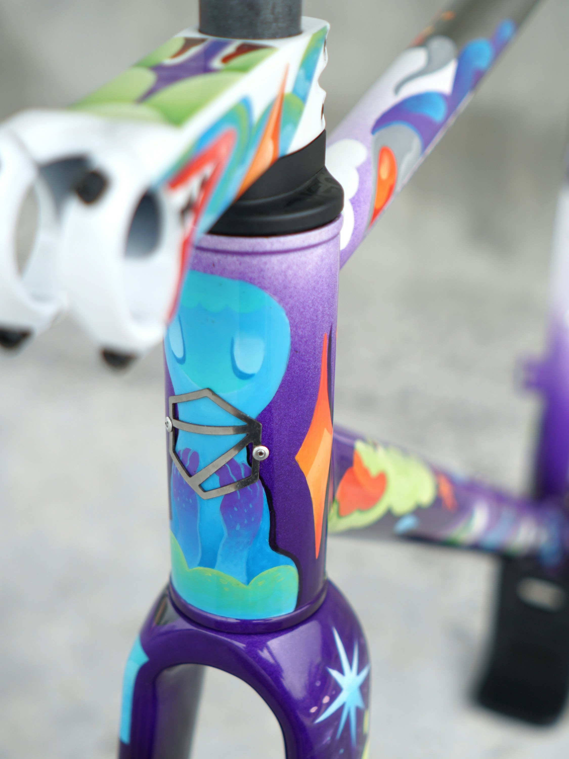 A bicycle frame is decorated with abstract art.