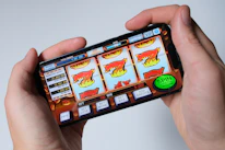 Someone is playing a mobile slot machine game.