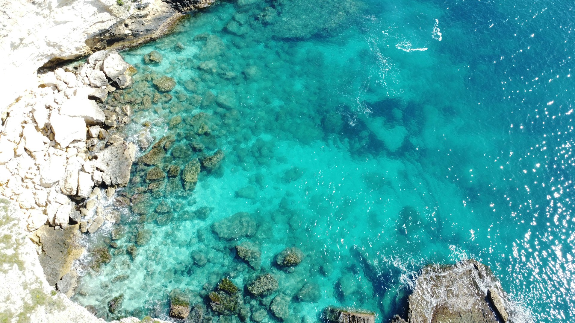 Aerial view of a stunning, turquoise coastline.
