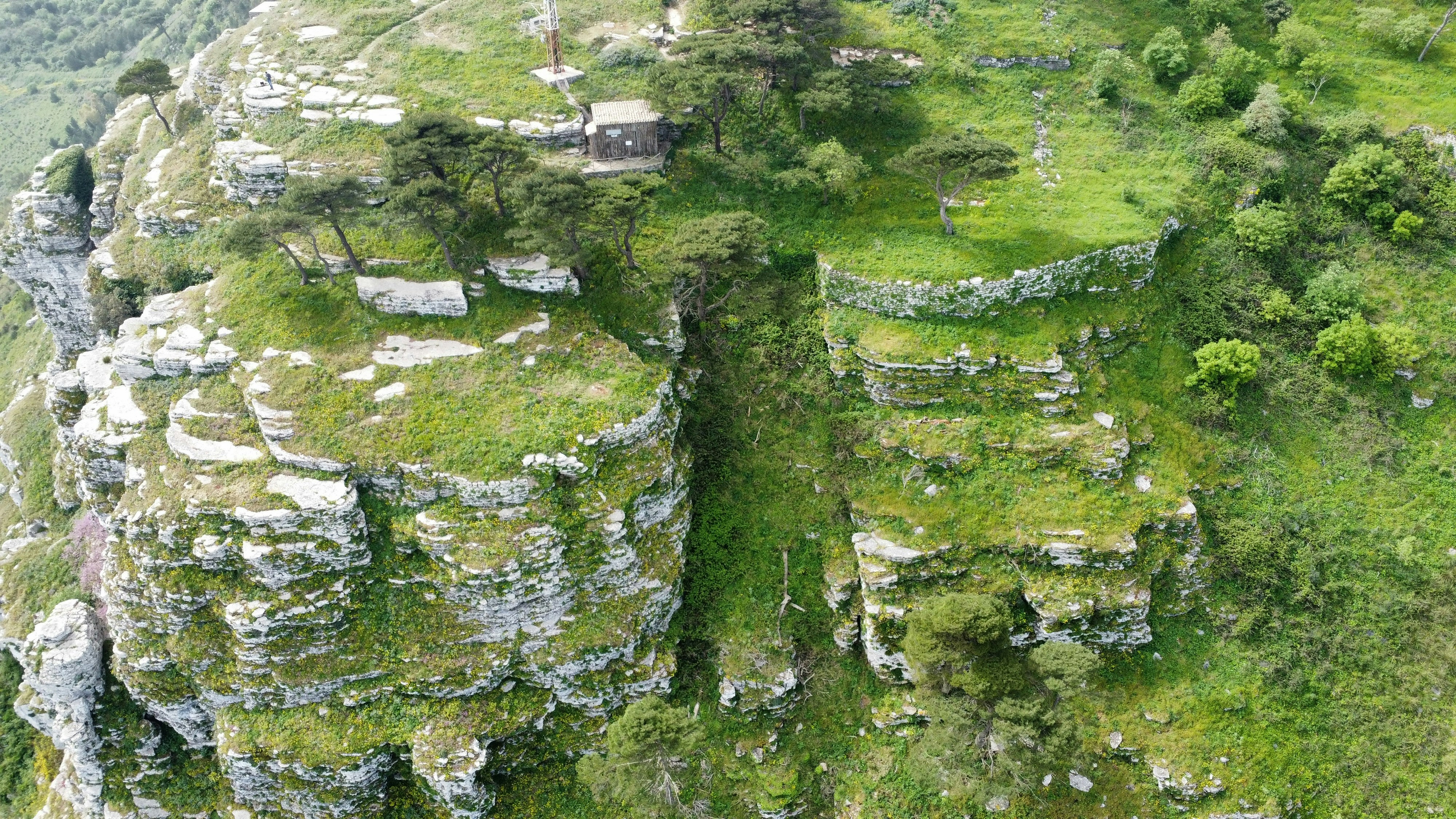 Rocky cliffs and lush vegetation dominate the landscape.