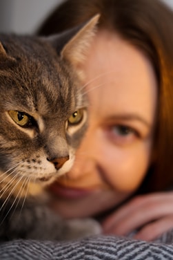 Cat and woman share a peaceful moment.