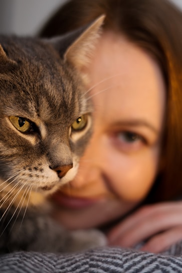 Cat and woman share a peaceful moment.