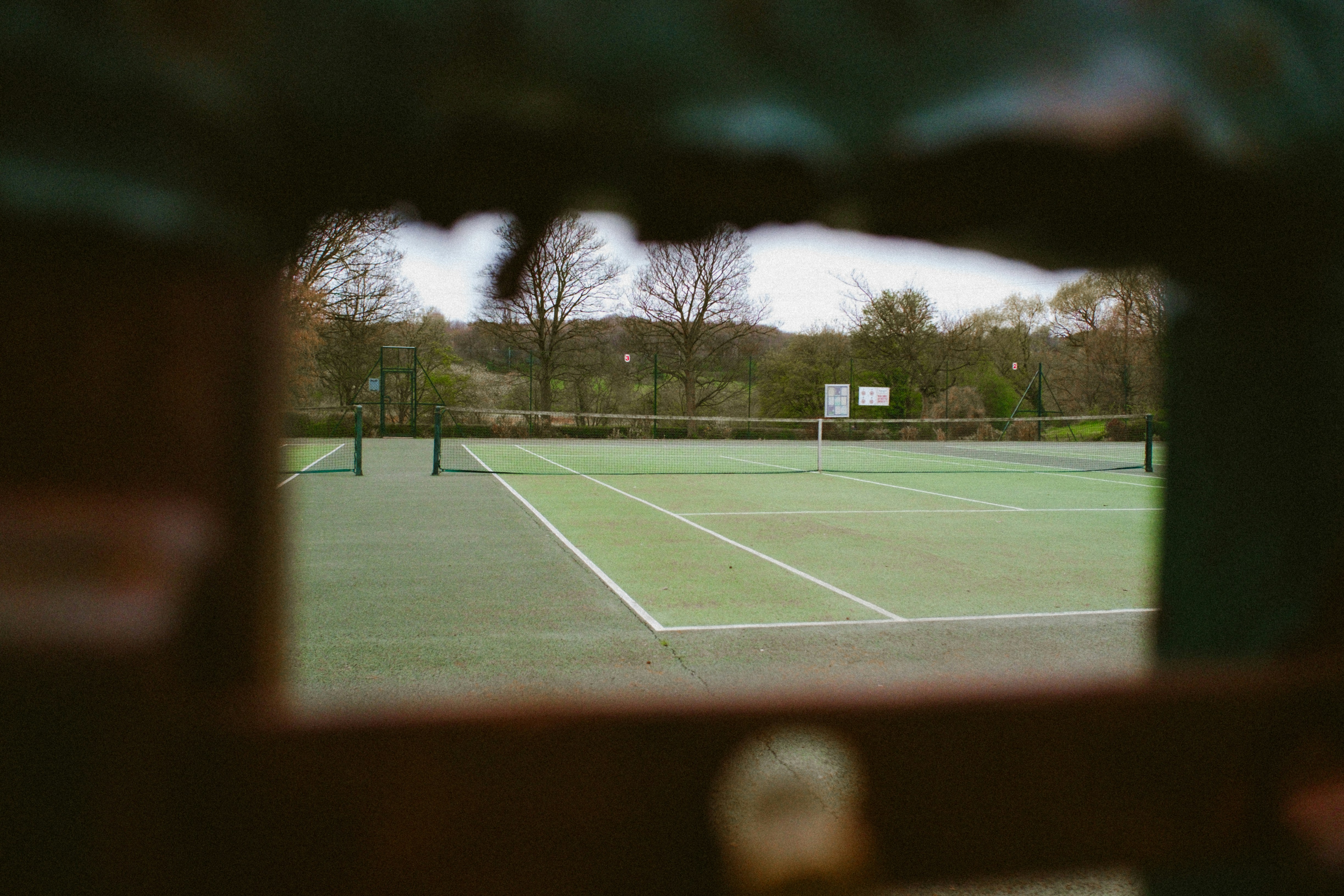Tennis court through window