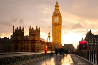 Big ben and parliament are illuminated at sunset.