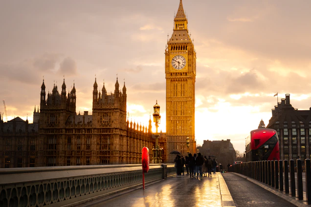 Big ben and parliament are illuminated at sunset.