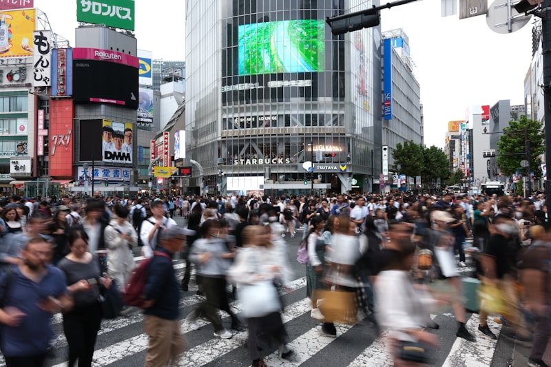 Tokyo intersection, road construction site, taxi cab, traffic flagman, urban roadwork