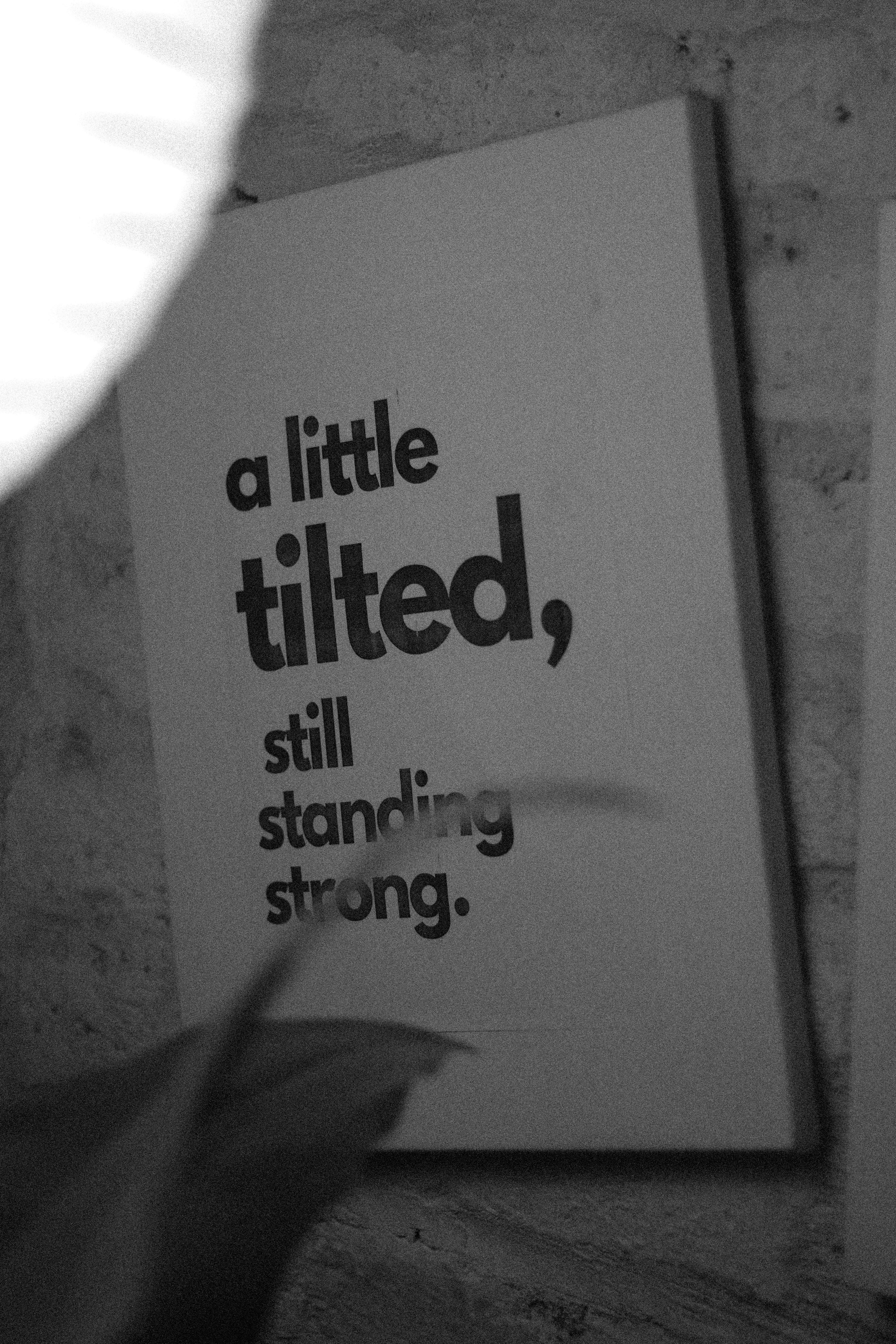 The sign states "a little tilted, still strong".