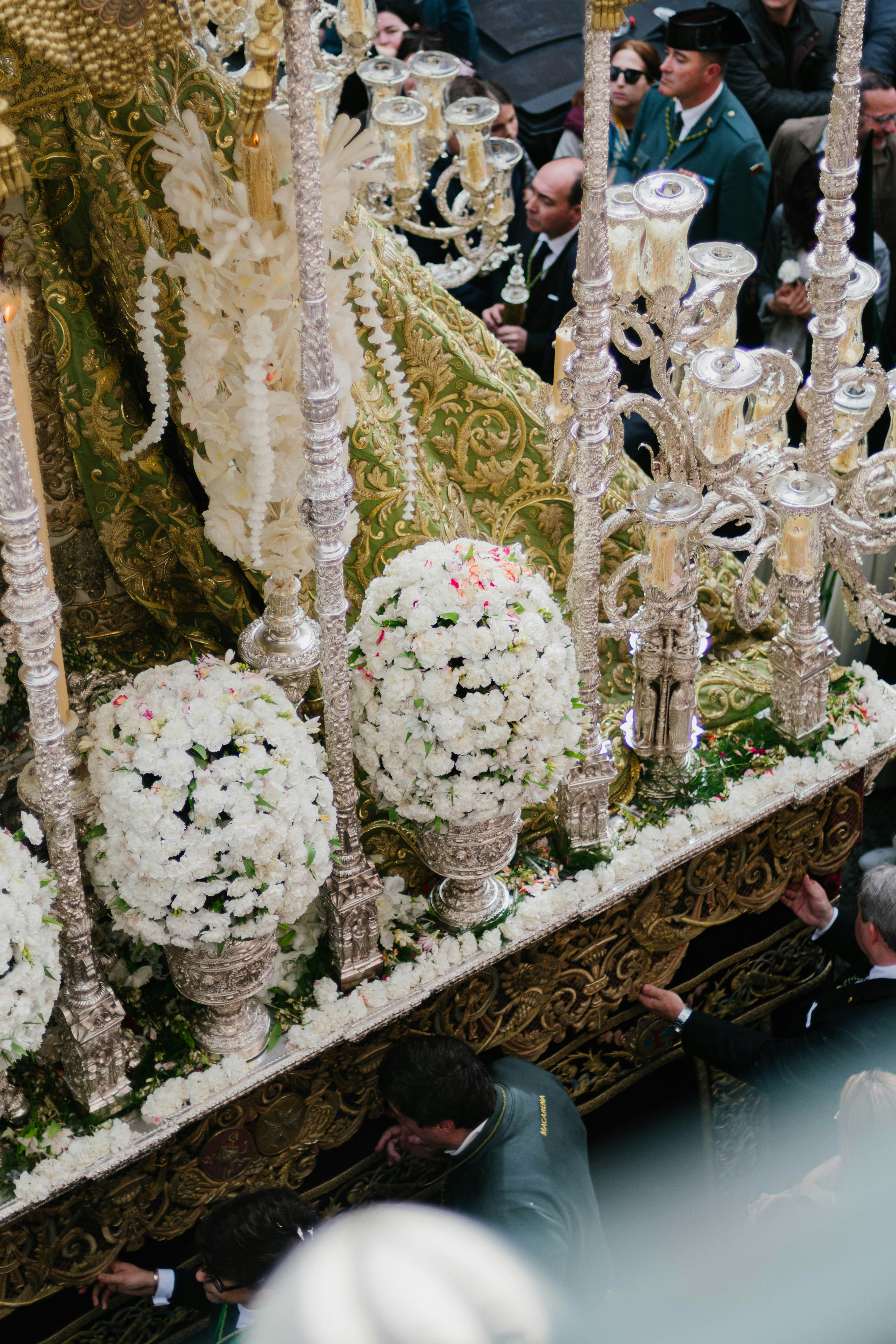 Religious procession carries a decorated float.