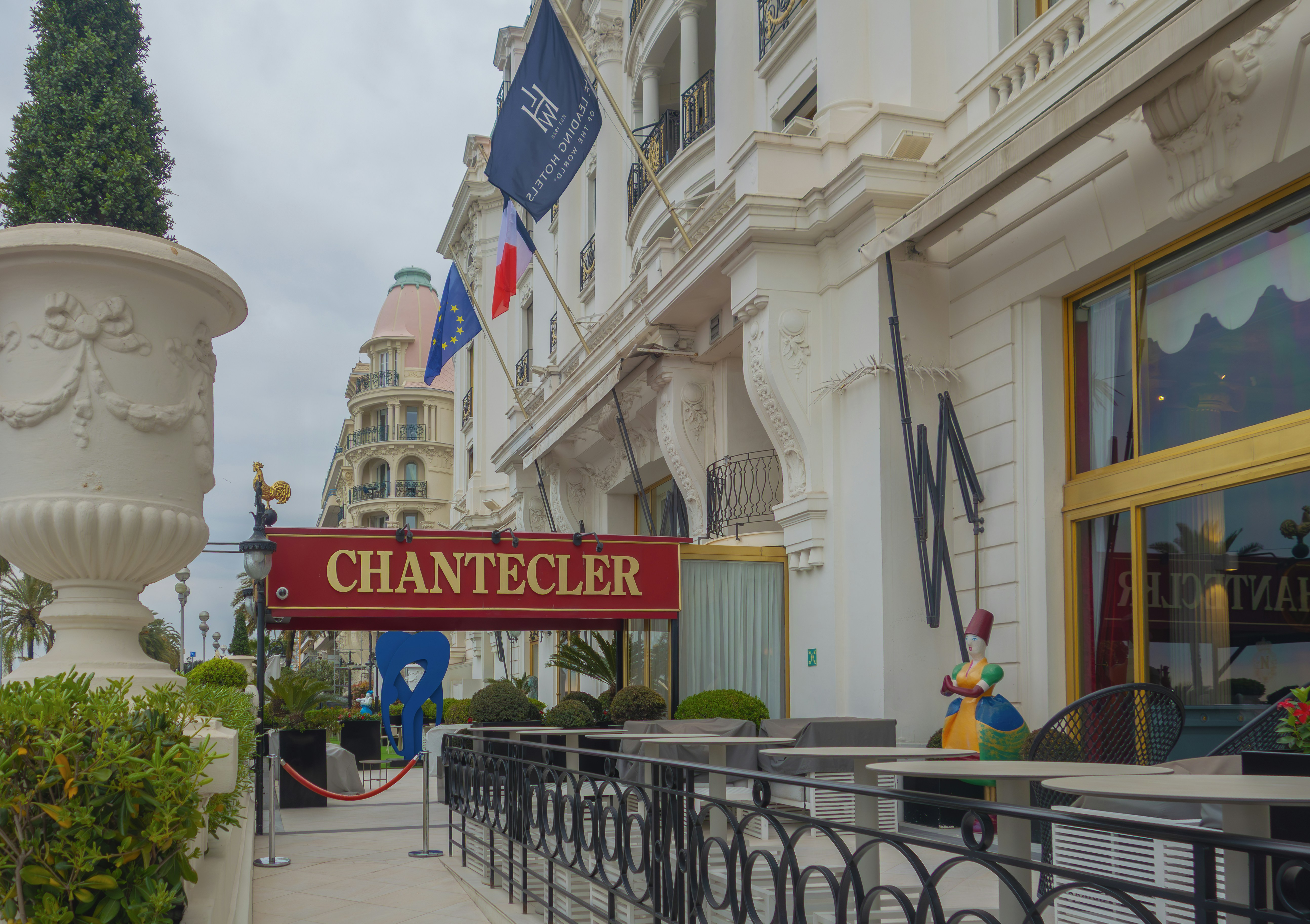 The chantecler restaurant is outside a building.