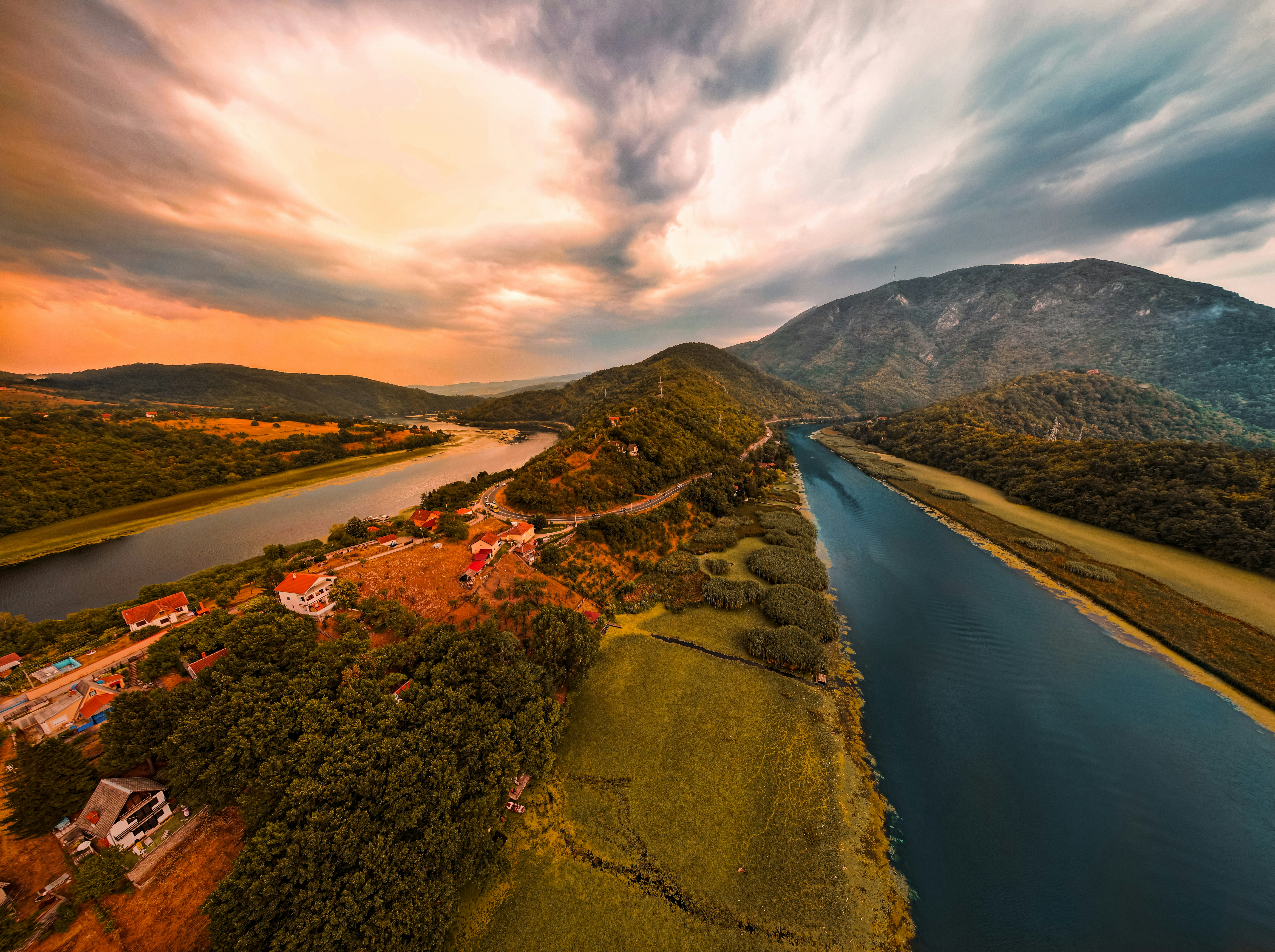 A winding river flows beside a mountain vista.