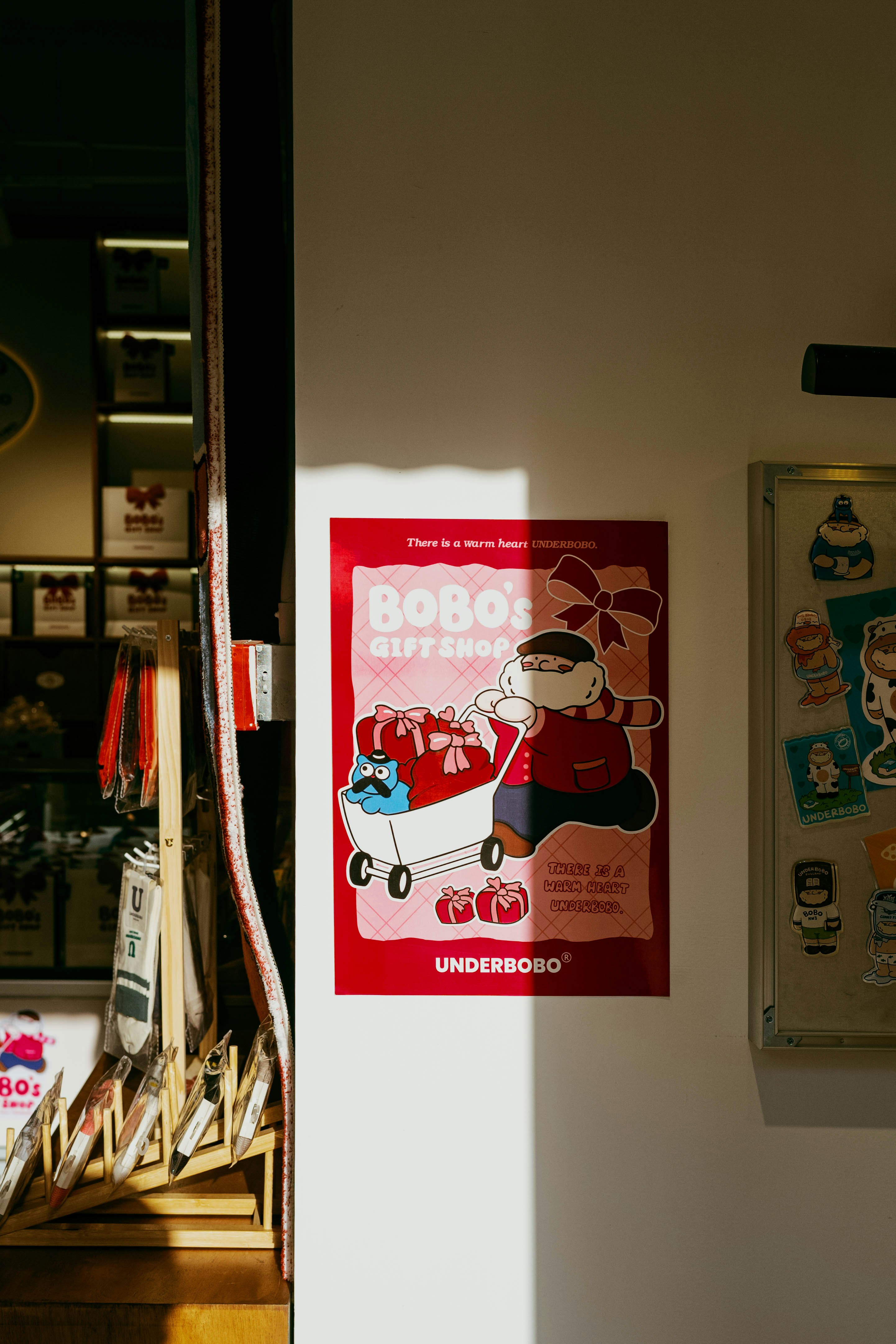 A red poster advertises a gift shop.