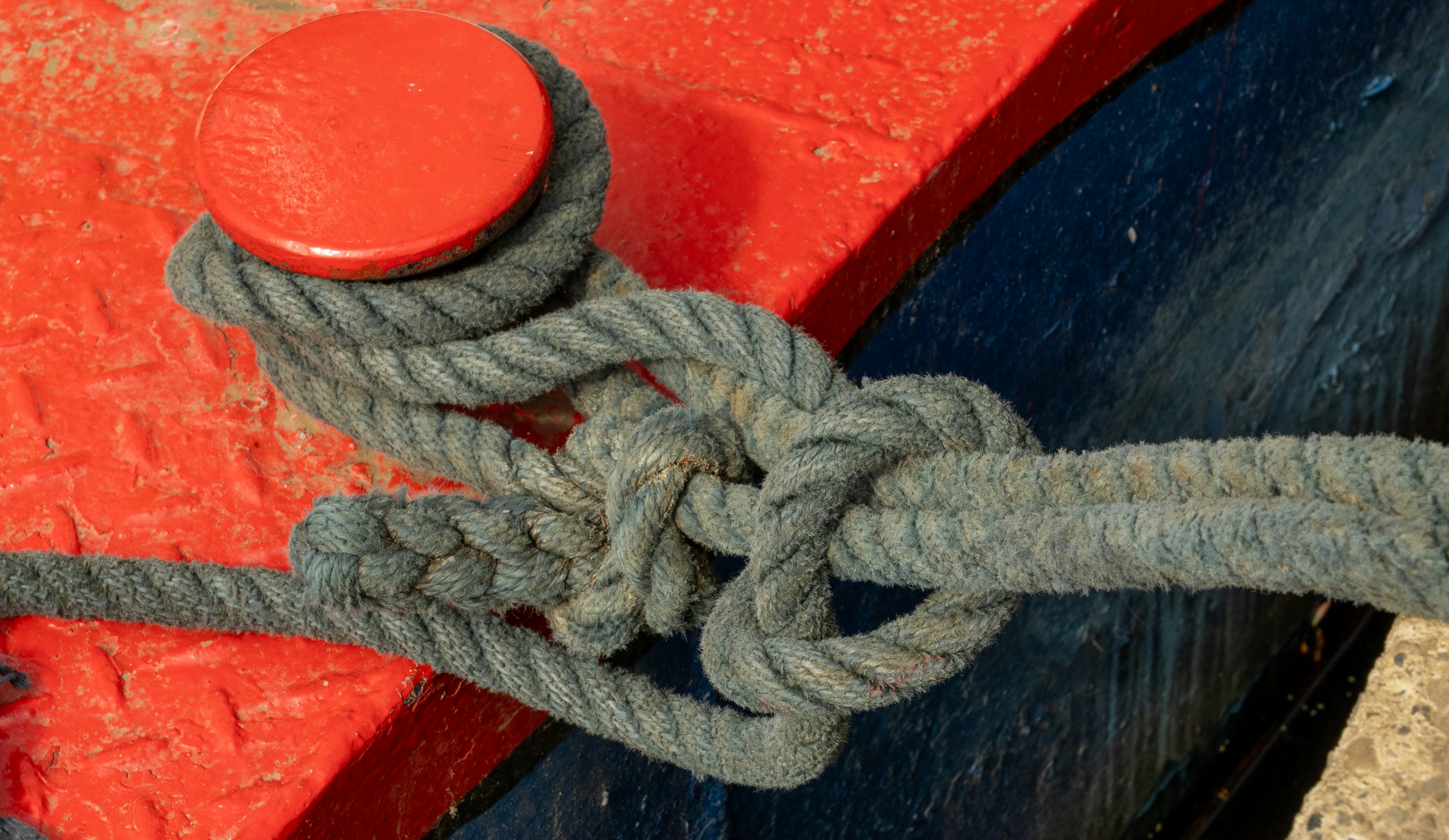 A rope is tied to a wooden post.