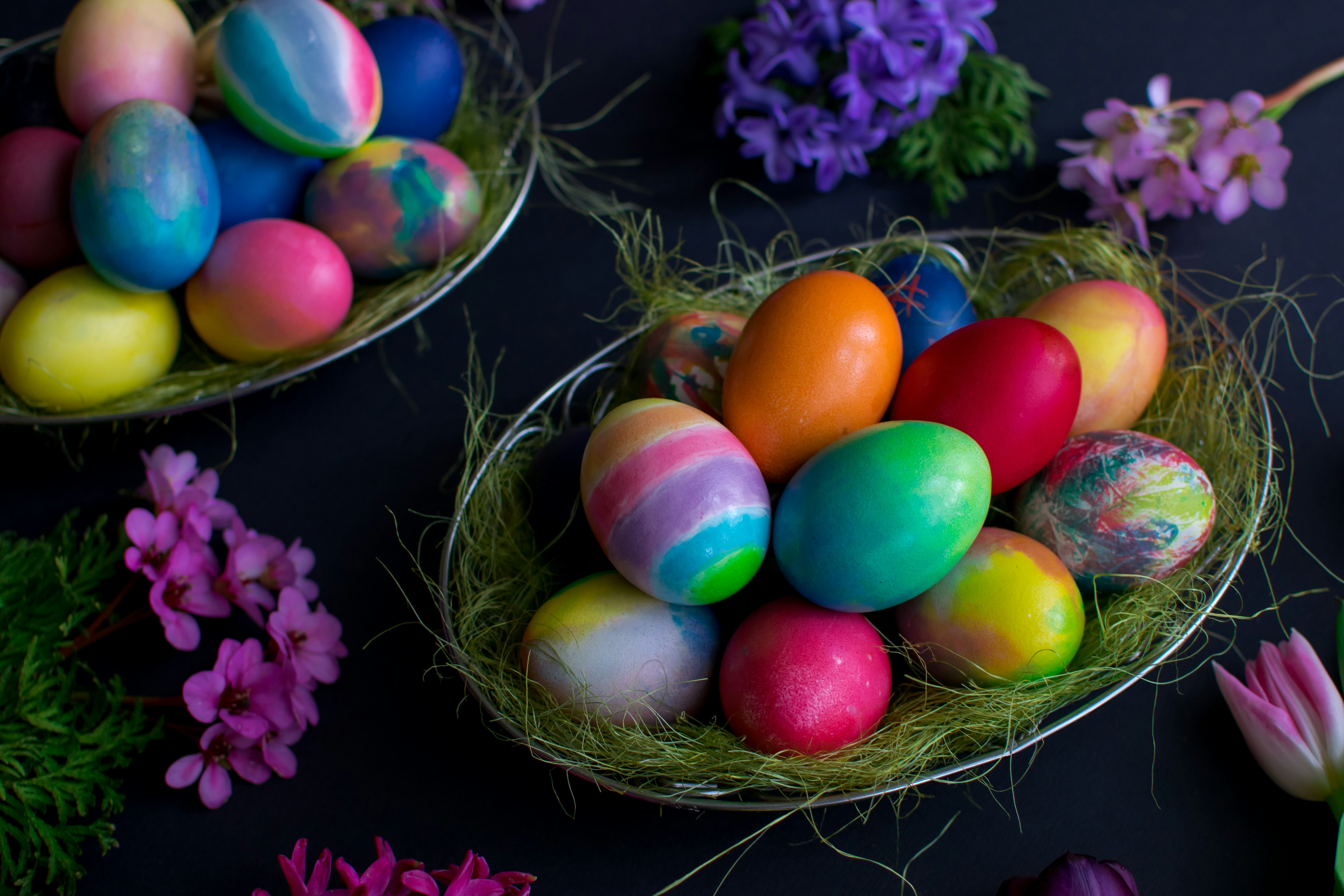 Easter eggs and flowers decorate the dark background.