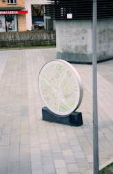 A round map is displayed outdoors.