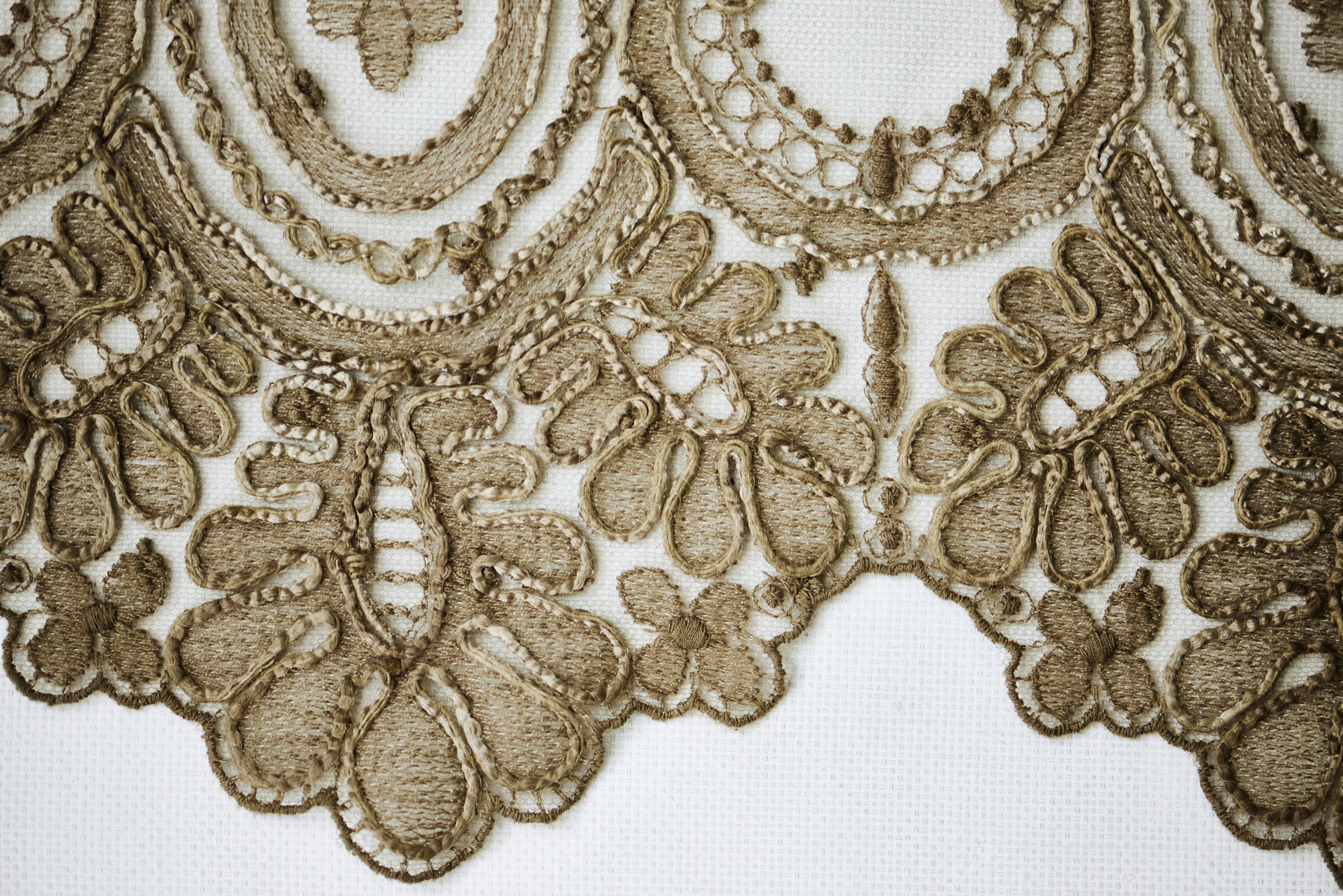 Detailed brown lace border on white.