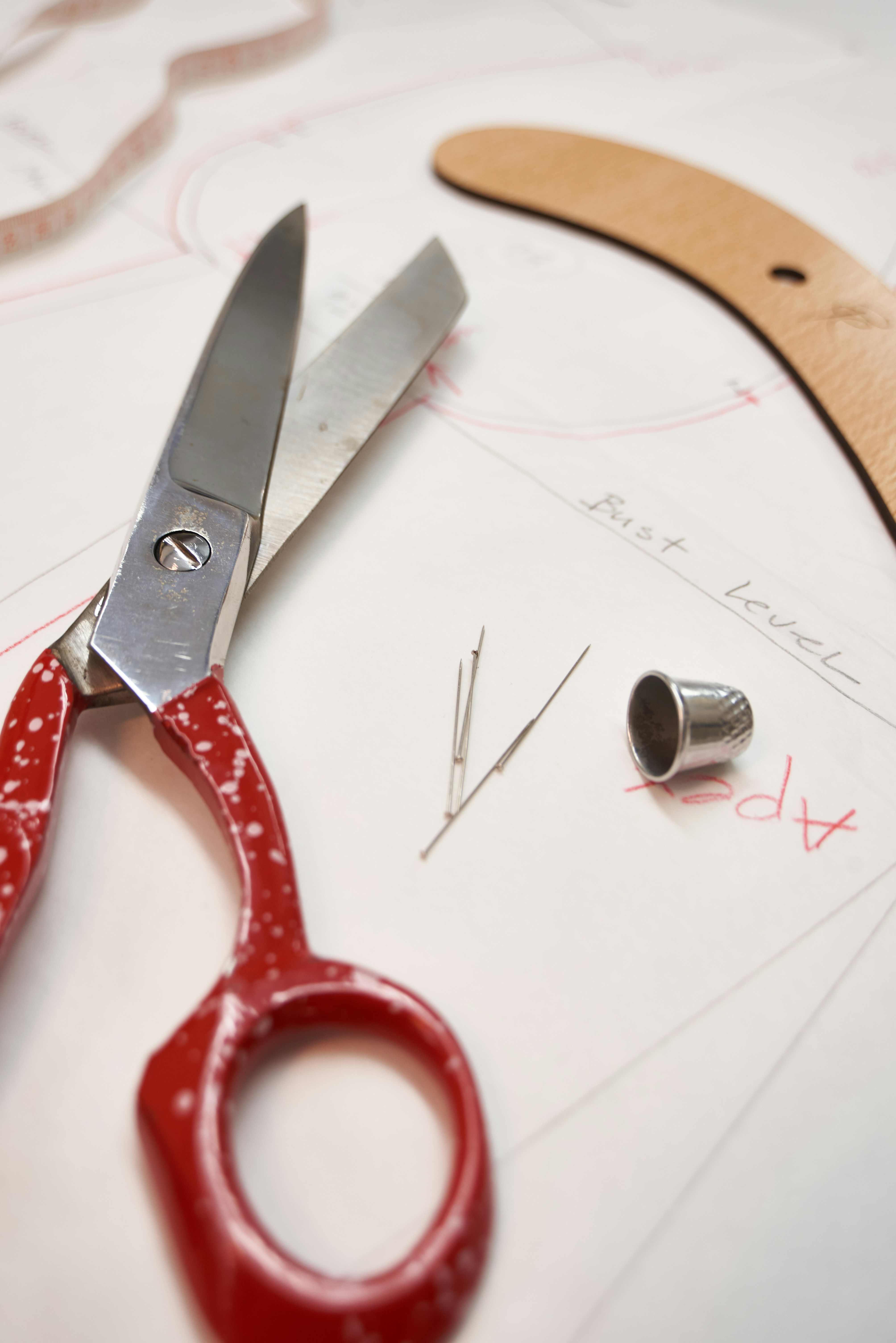 Sewing supplies and pattern on a table.