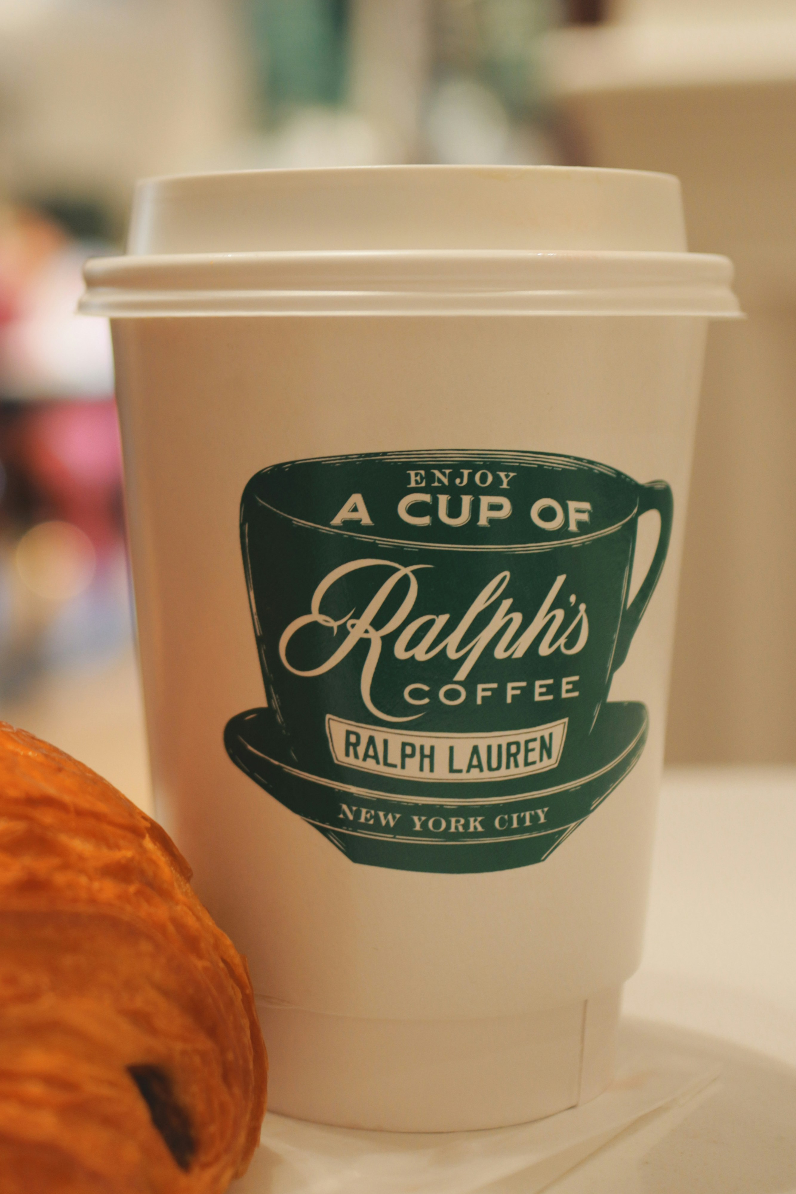 A cup of ralph's coffee, ready to go.