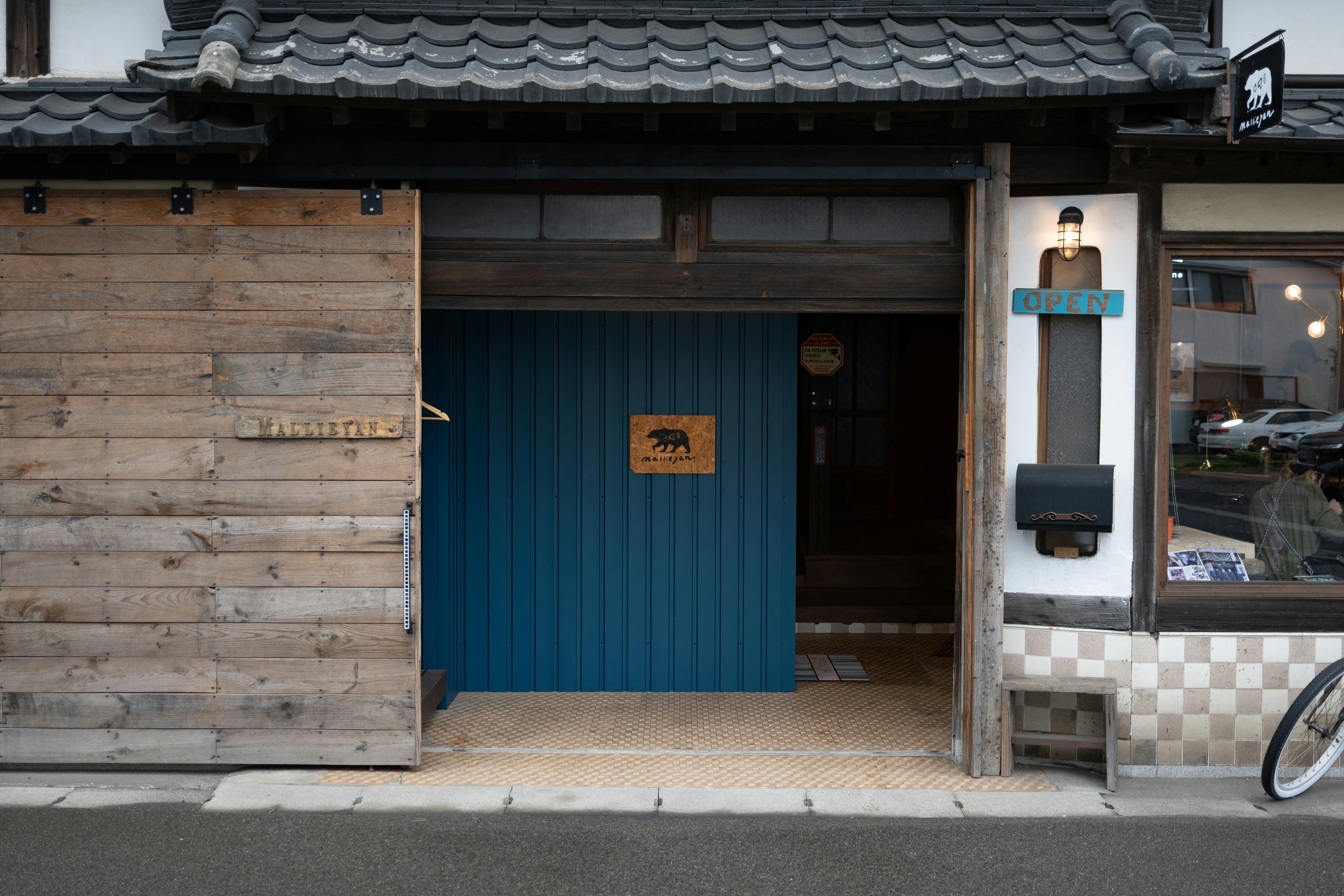 A japanese shop entrance with wooden details.