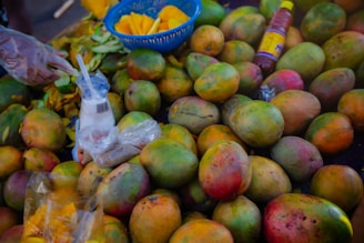 Many fresh and ripe mangoes are on display.