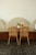 Two chairs and a small table in a cafe.