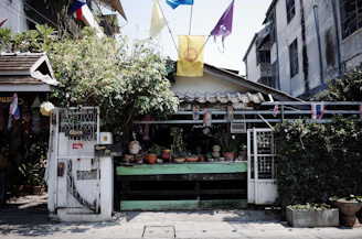 A charming shop is decorated with colorful flags