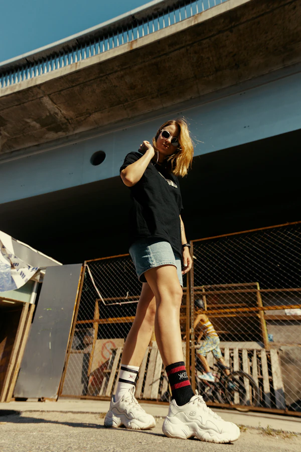 Woman in casual streetwear walking outdoors in mild weather