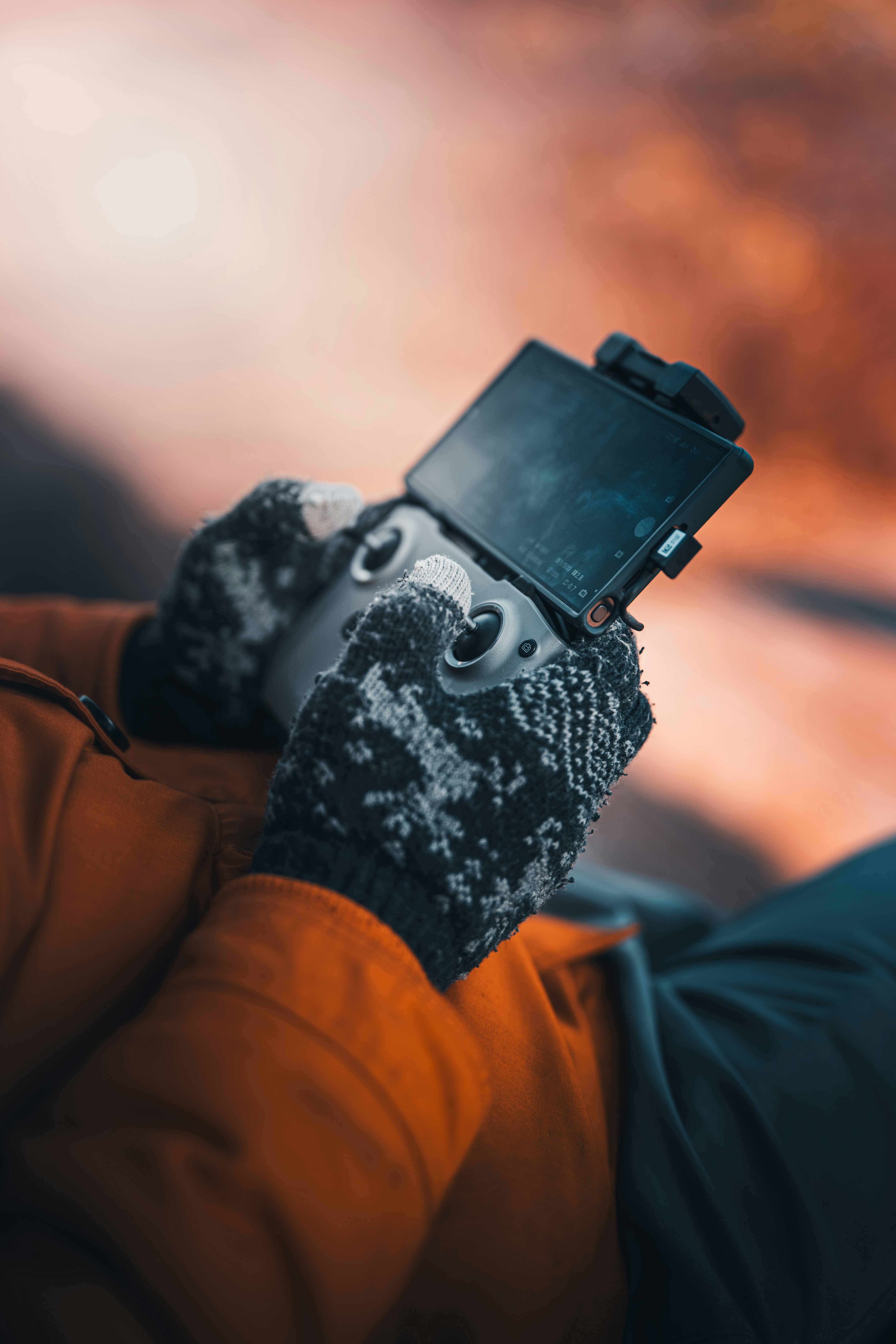 A person controls a drone with a remote.