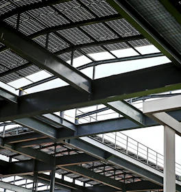 Steel beams and roofing in a modern construction.