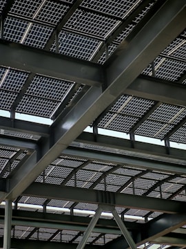 Solar panels are installed on a steel-framed roof.