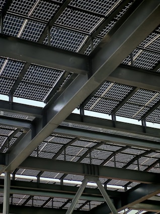Solar panels are installed on a steel-framed roof.