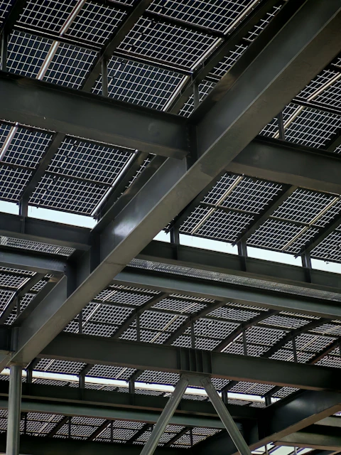 Solar panels are installed on a steel-framed roof.