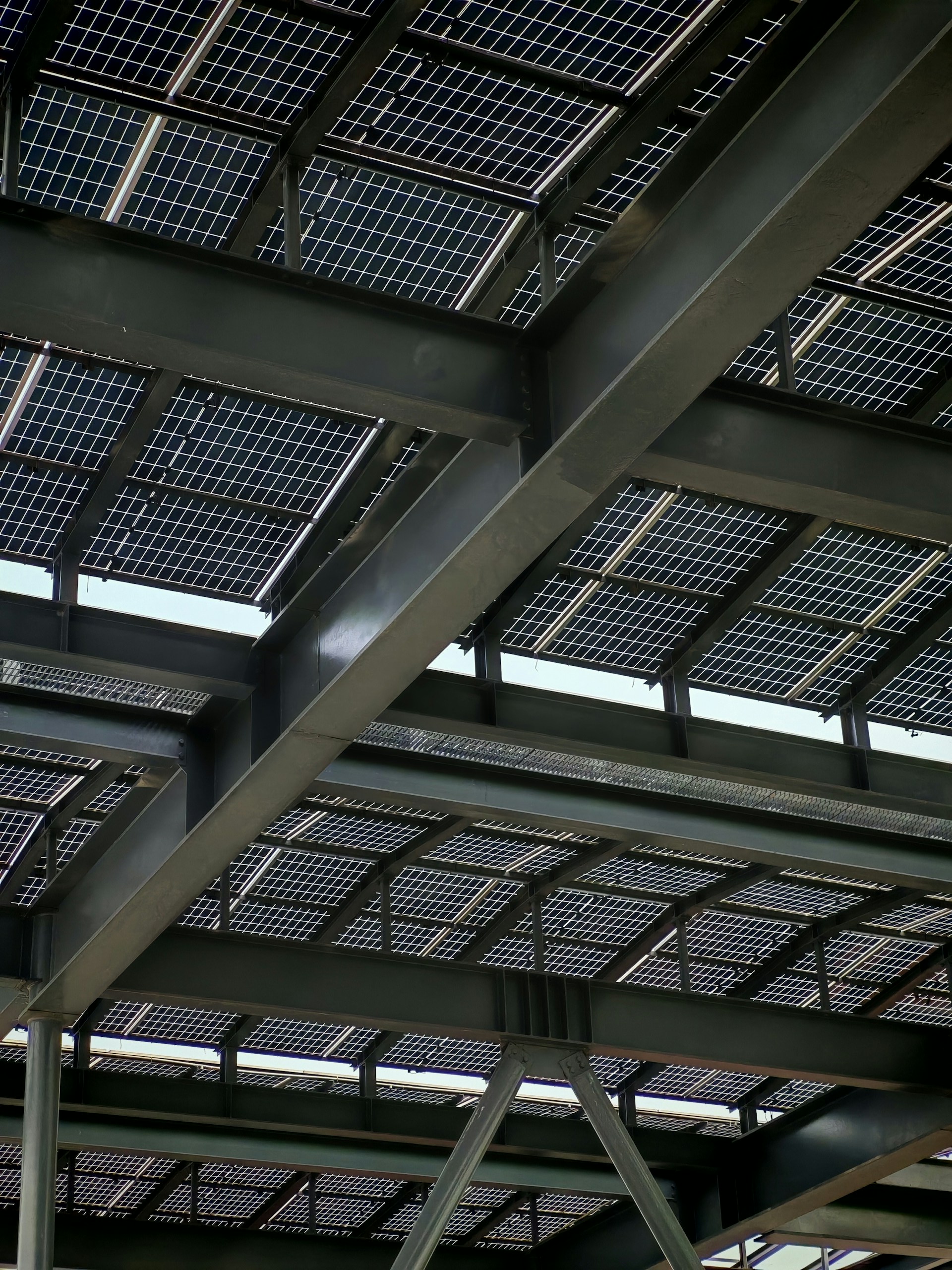 Solar panels are installed on a steel-framed roof.