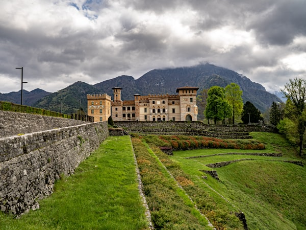 Medieval castle among green hills in Italy