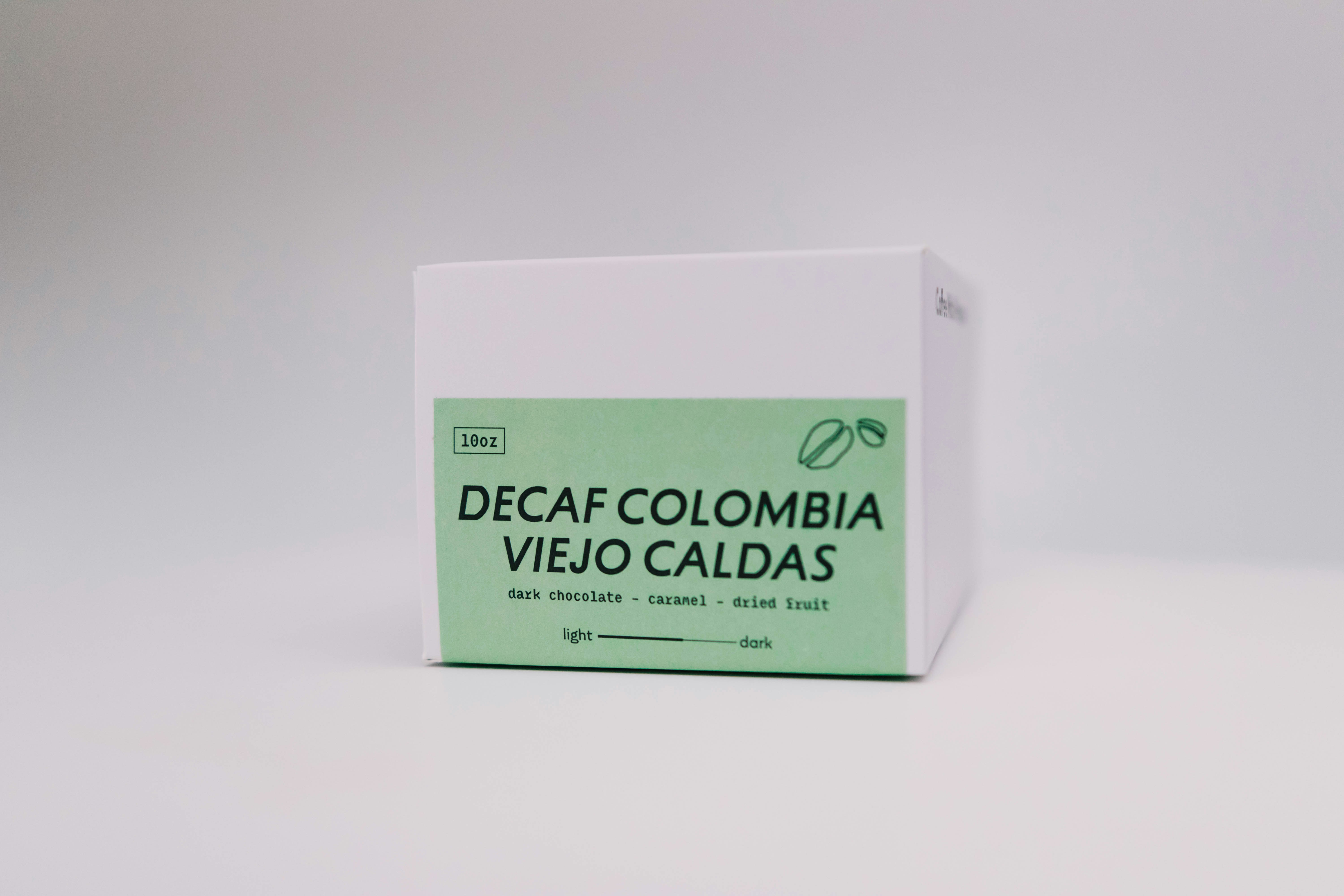 A box of decaf colombia coffee is pictured.