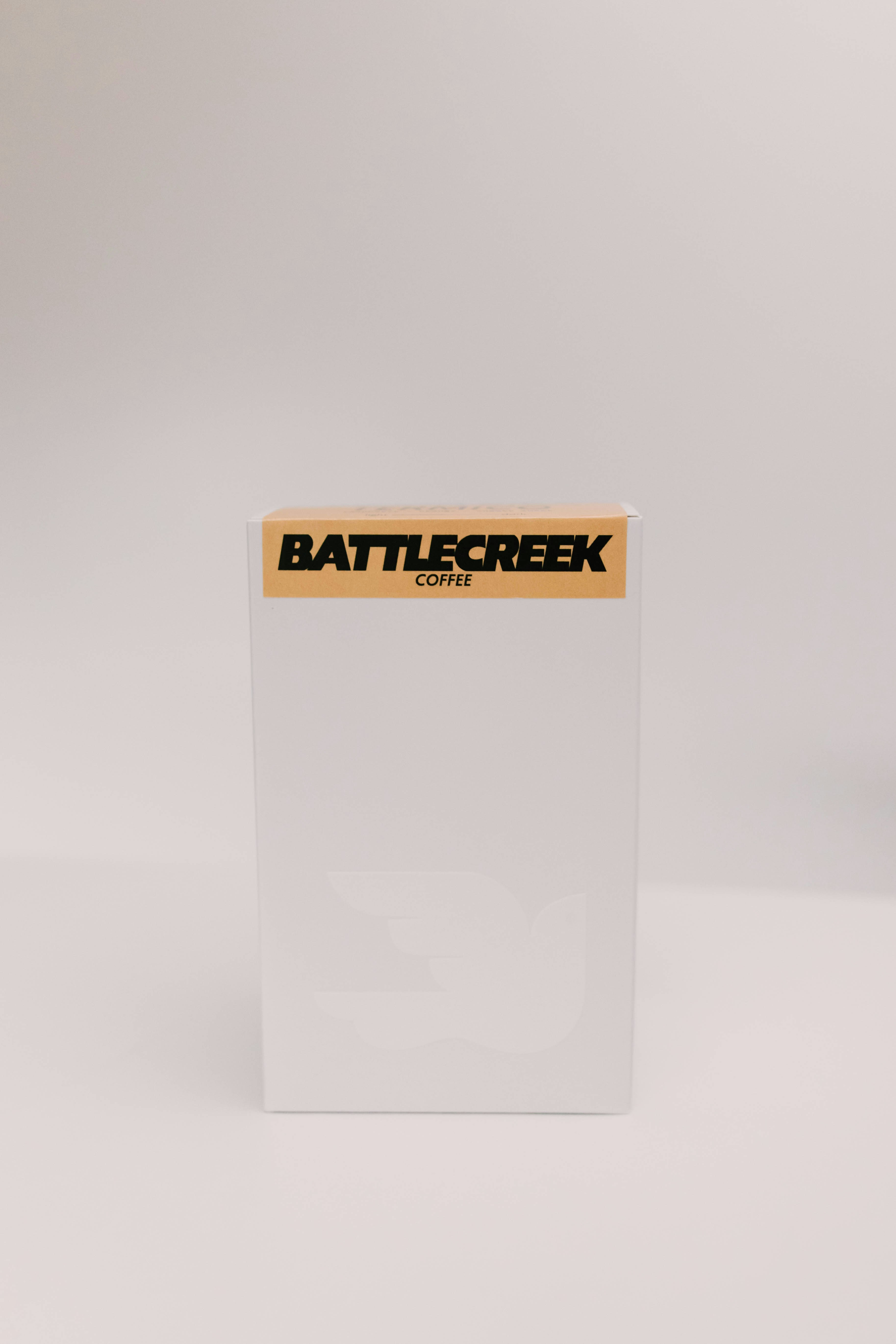 A white box of battle creek coffee.