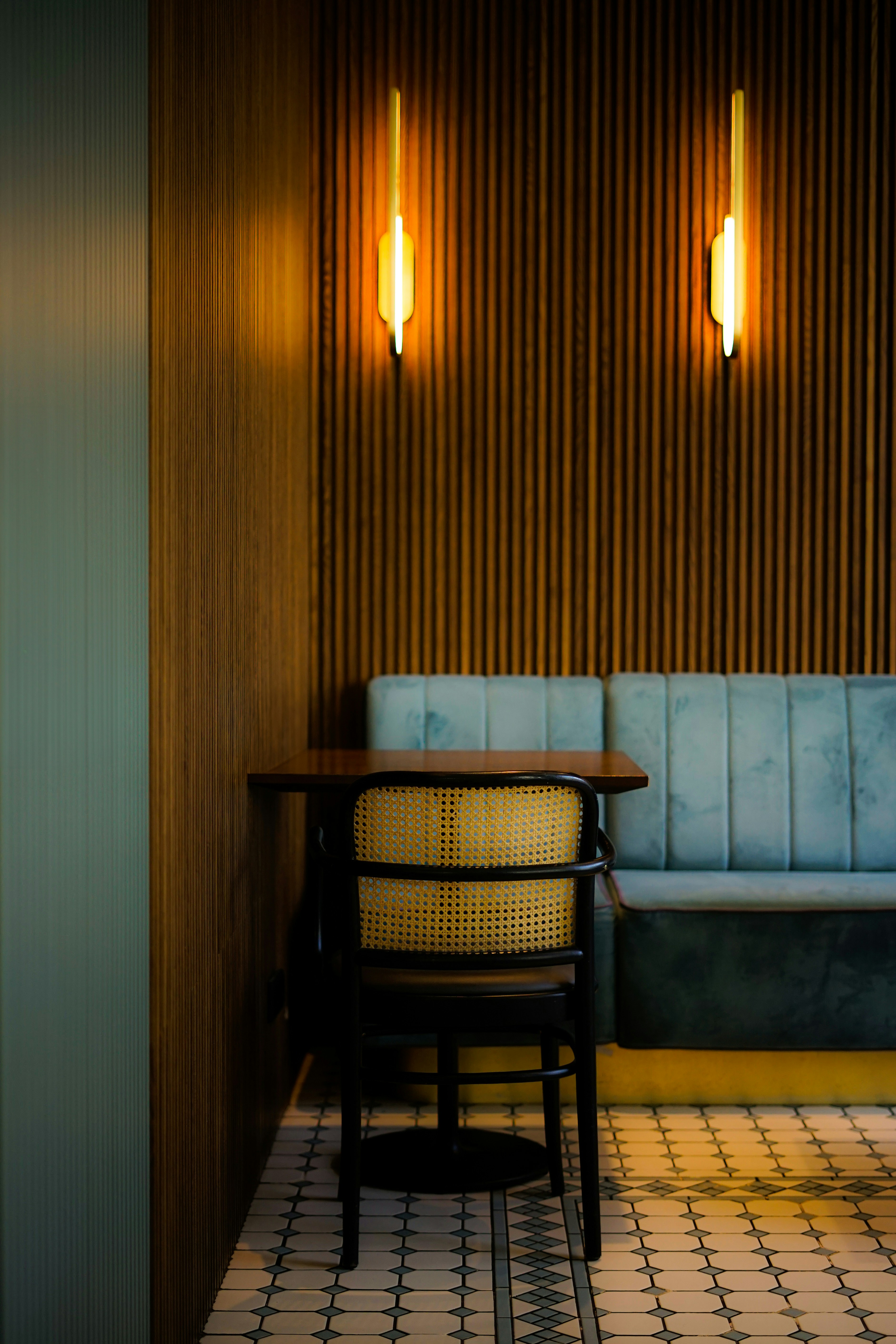 Cozy booth seating and warm lighting creates a warm vibe.