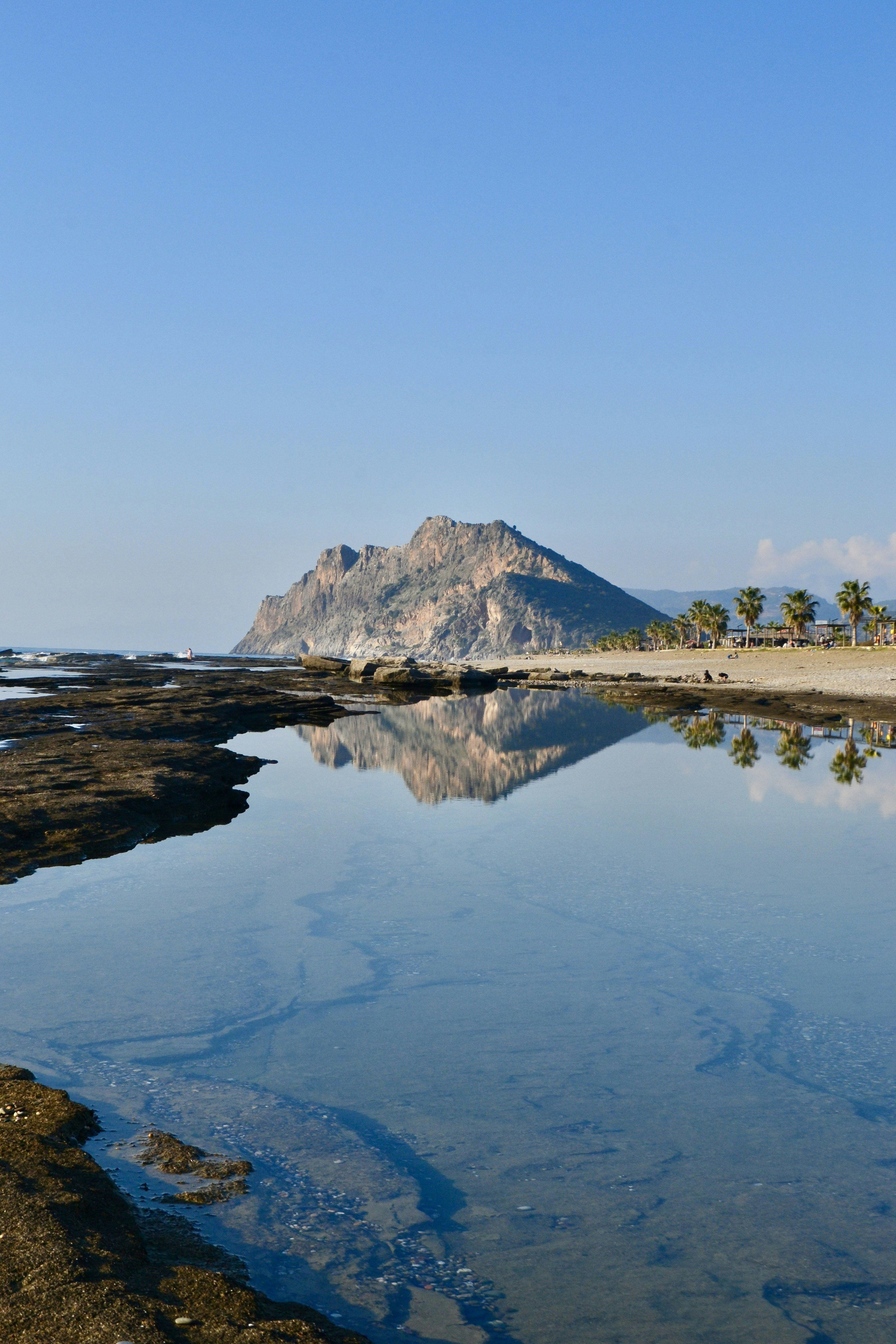 Mountain and its reflection on the calm waters.