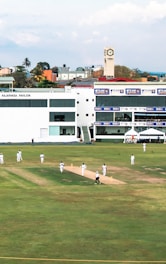 A cricket match is happening on the field.