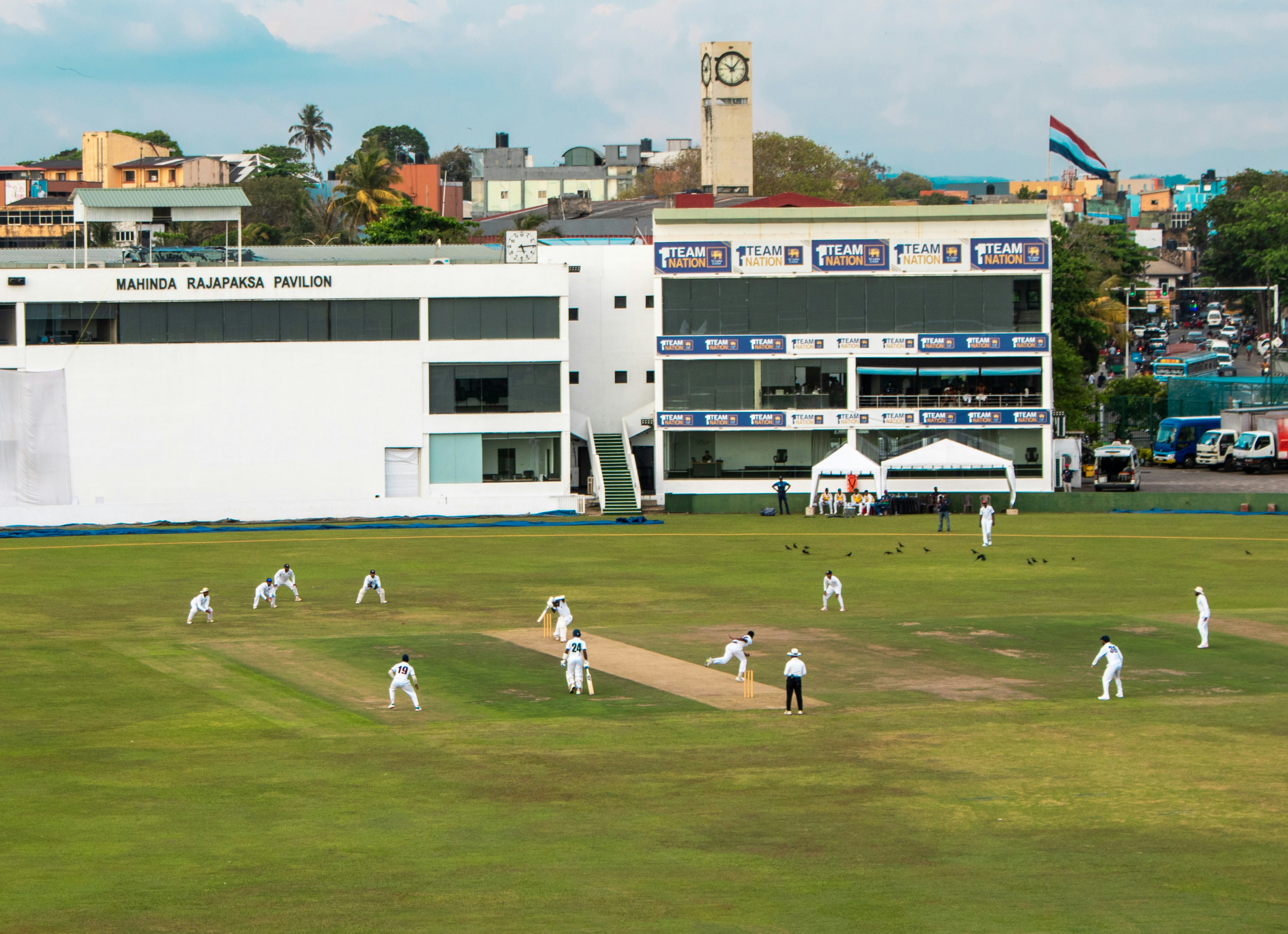 Batter hitting ball at cricket stadium