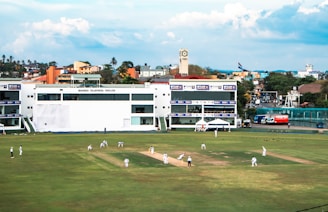 Cricket match in progress at the stadium.